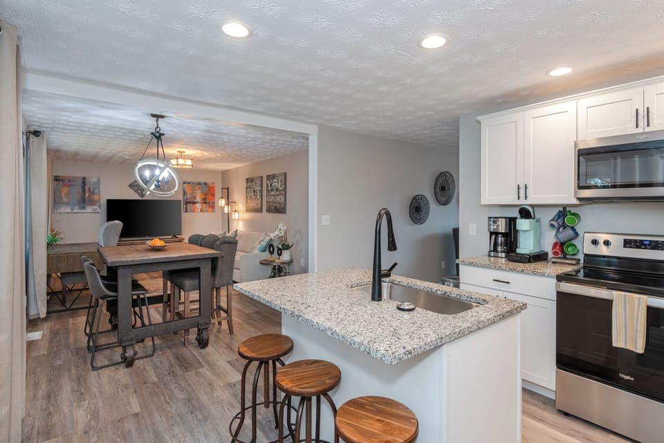 Stylish and functional, with modern appliances including a microwave and dishwasher.