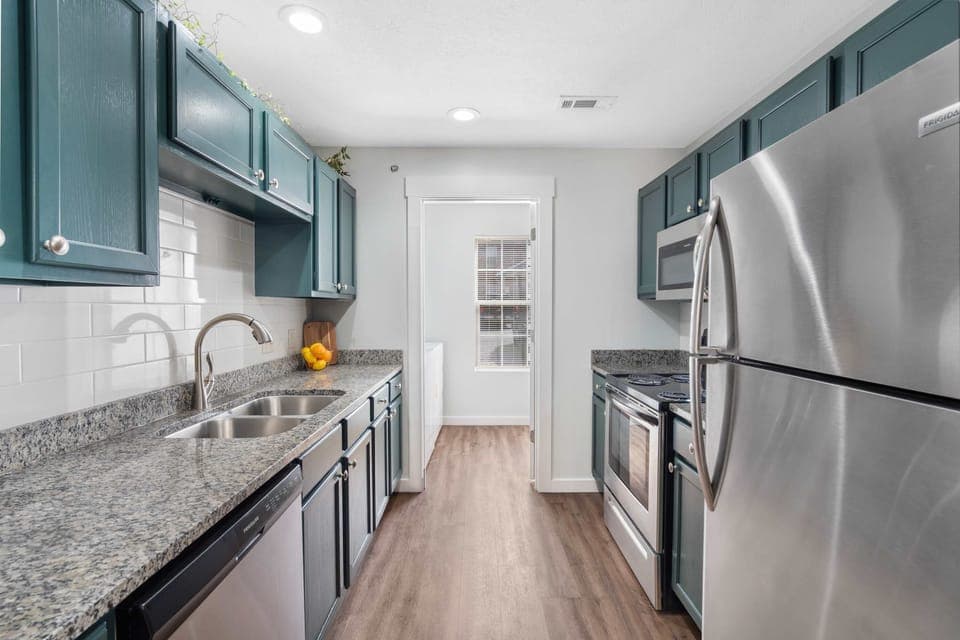 The open, airy kitchen offers ample space & all the comforts of home