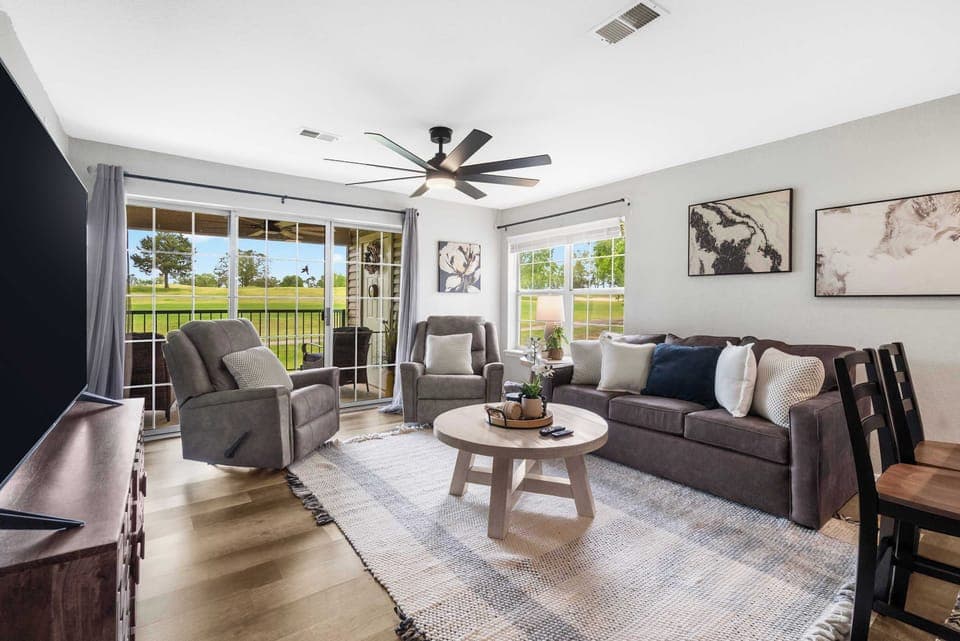 Bright airy living space with sofa sleeper and Smart tv.