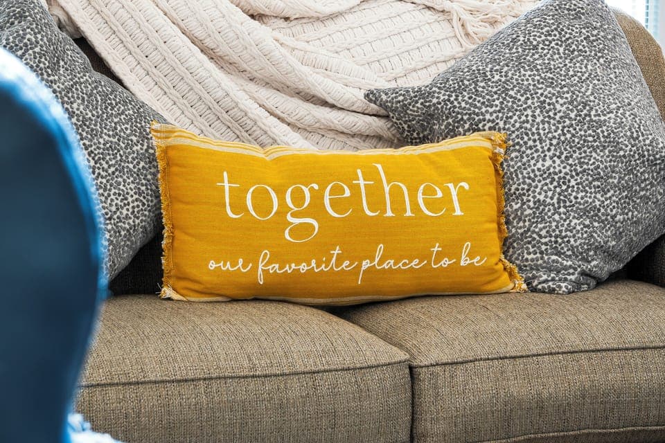 Spacious living room with balcony access TV, and Queen size sofa sleeper