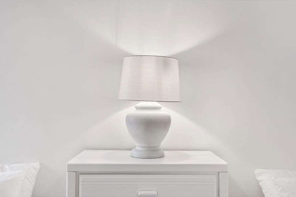 This 1st floor bedroom includes a pair of cozy full-sized beds