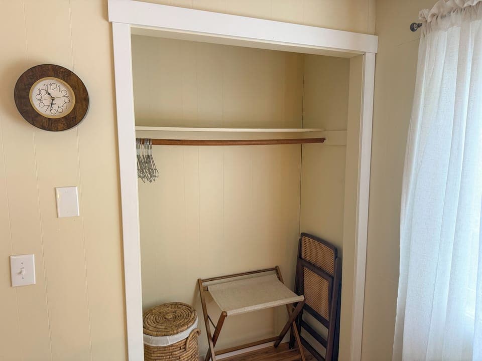 A luggage rack and extra chair in both bedrooms. 