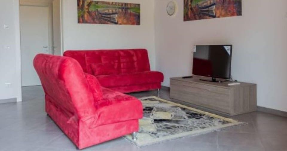 Design Apartment | Living area | 40-inch Smart TV with satellite channels, Netflix, streaming services