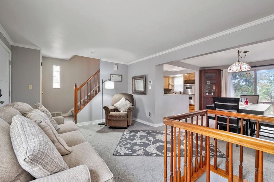 Open concept living room with assisted lifting chair for seniors