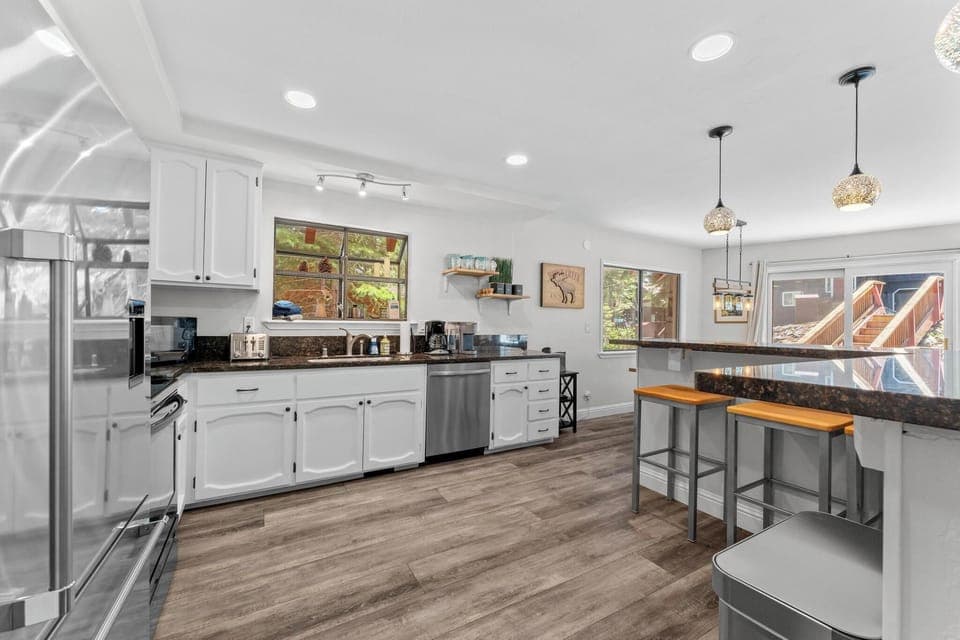 Kitchen with Bar top seating for 3
