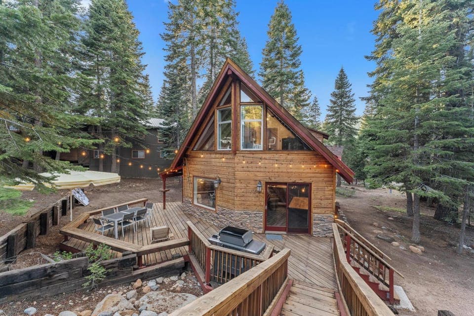 Front of Cabin stairs leading down to wrap around deck from driveway