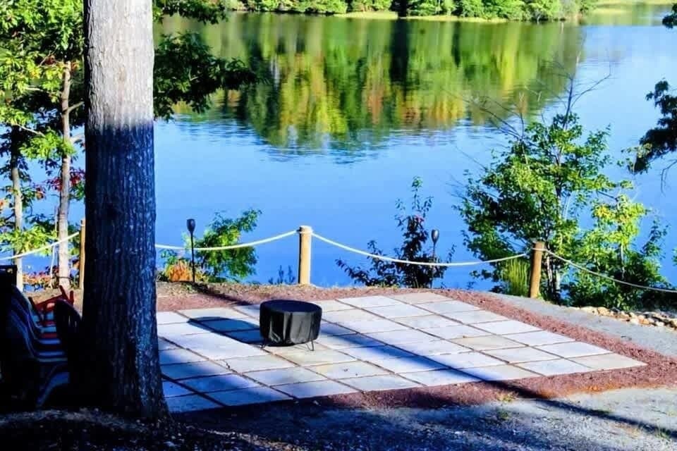 Unwind on the brand-new patio with serene water views, featuring a smokeless fire pit ideal for roasting marshmallows and making s'mores under the stars.