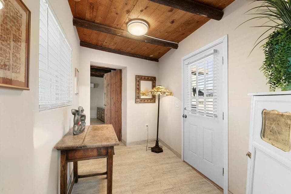 Throughway to Primary Suite and access to back patio