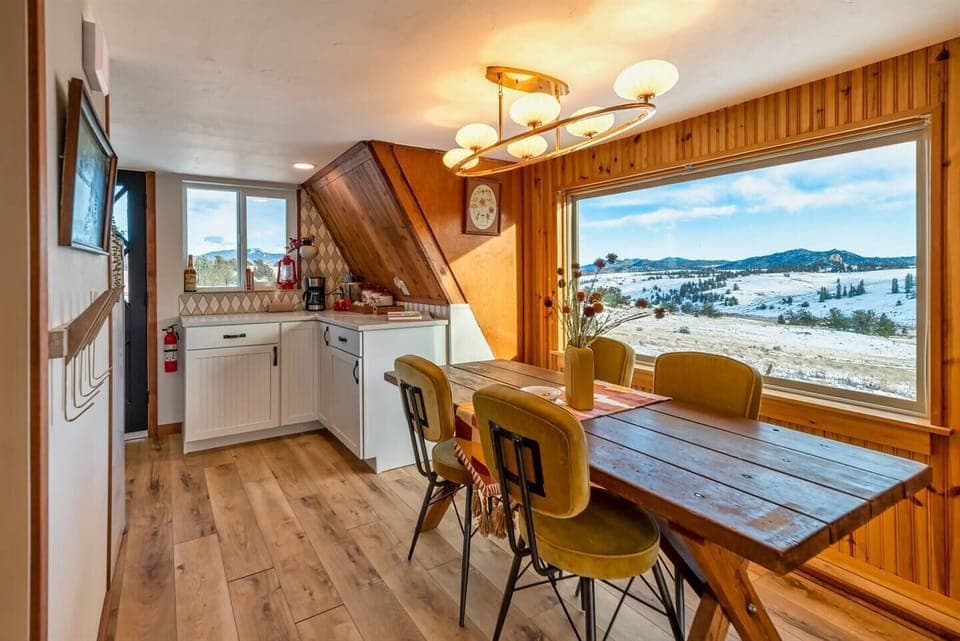 Enjoy the mountain views from the dining room located off the kitchen. 