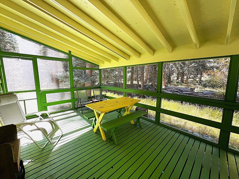 Back Enclosed Patio with Grill and Seating