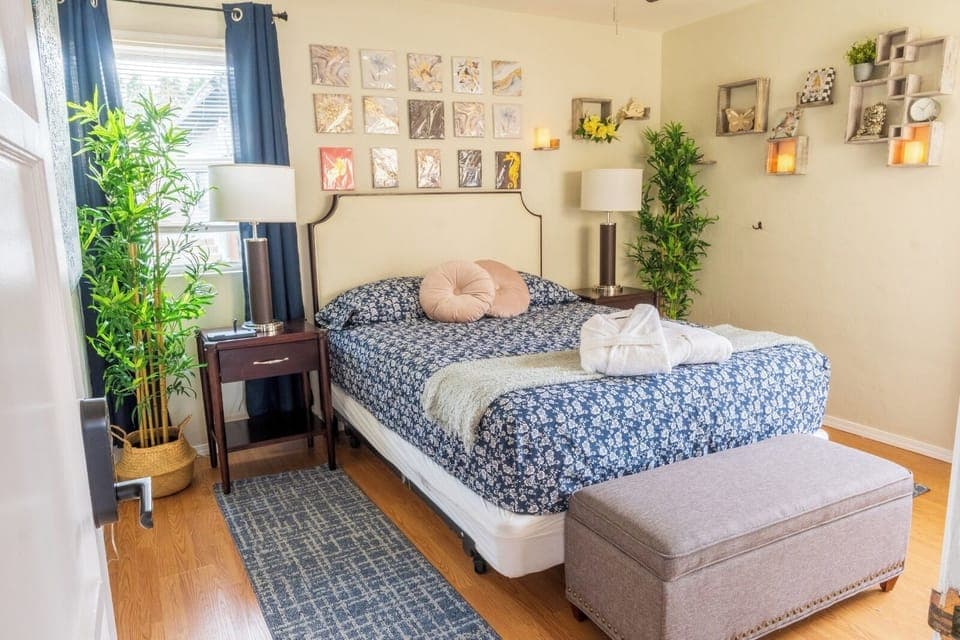 Queen bed,: plush bed, night light, Iron, chic décor, for ultimate comfort.