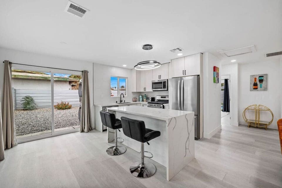 Light-filled interior space w/ clean lines, contemporary decor & easy access to the outdoors.