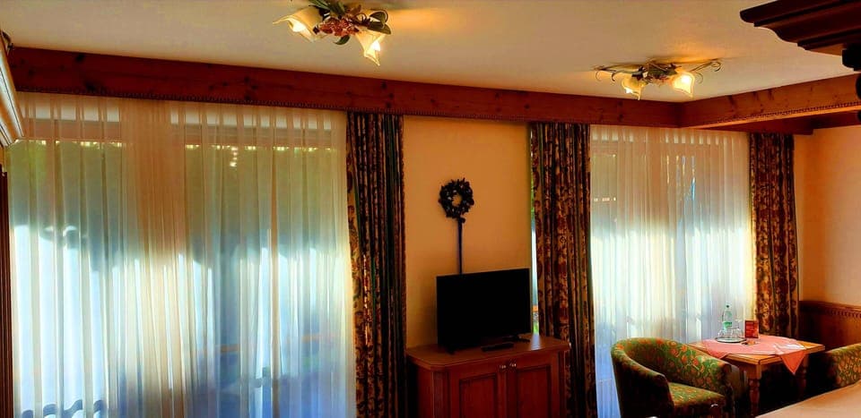 Triple Room | Living area | TV