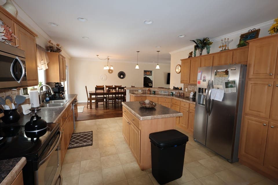 Fully stocked kitchen in Hocking Hills cabin—spacious and perfect for preparing meals.
