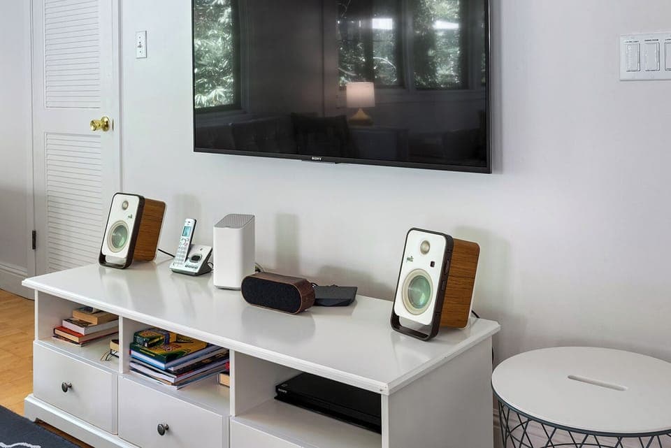 Living room flat screen TV and sound system.