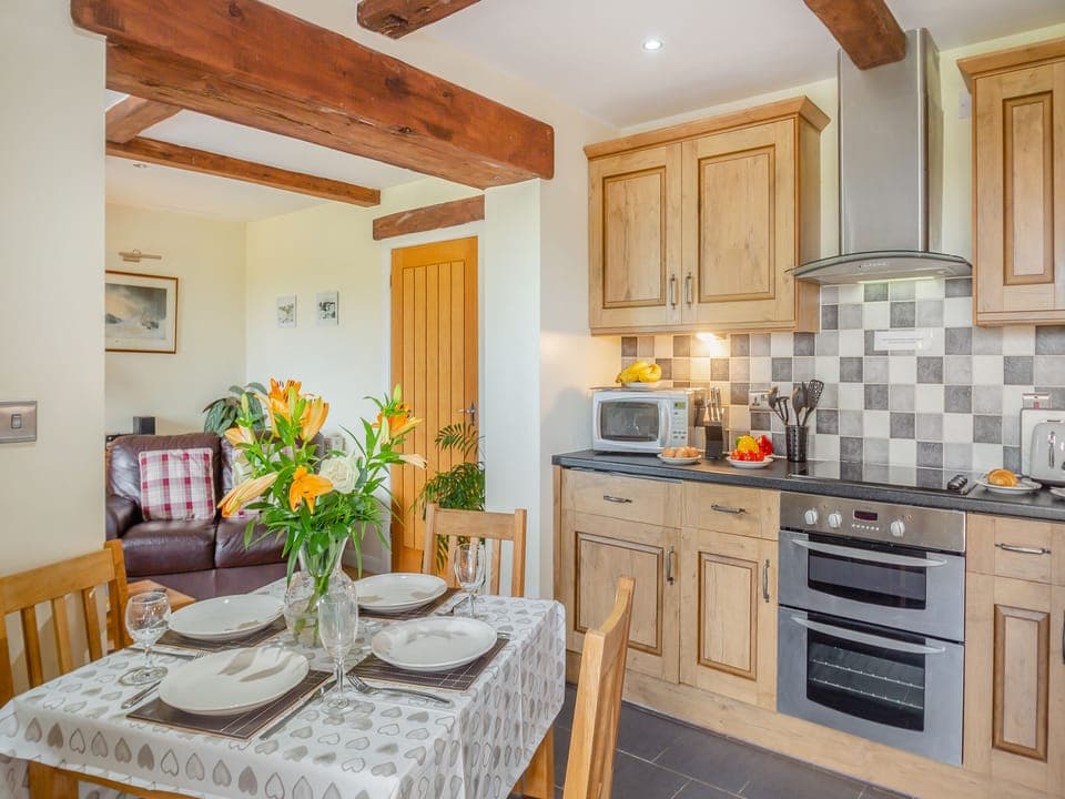 Kitchen/diner | Bryn Awelon Bach - Moelfre Cottages, Moelfre, near Benllech