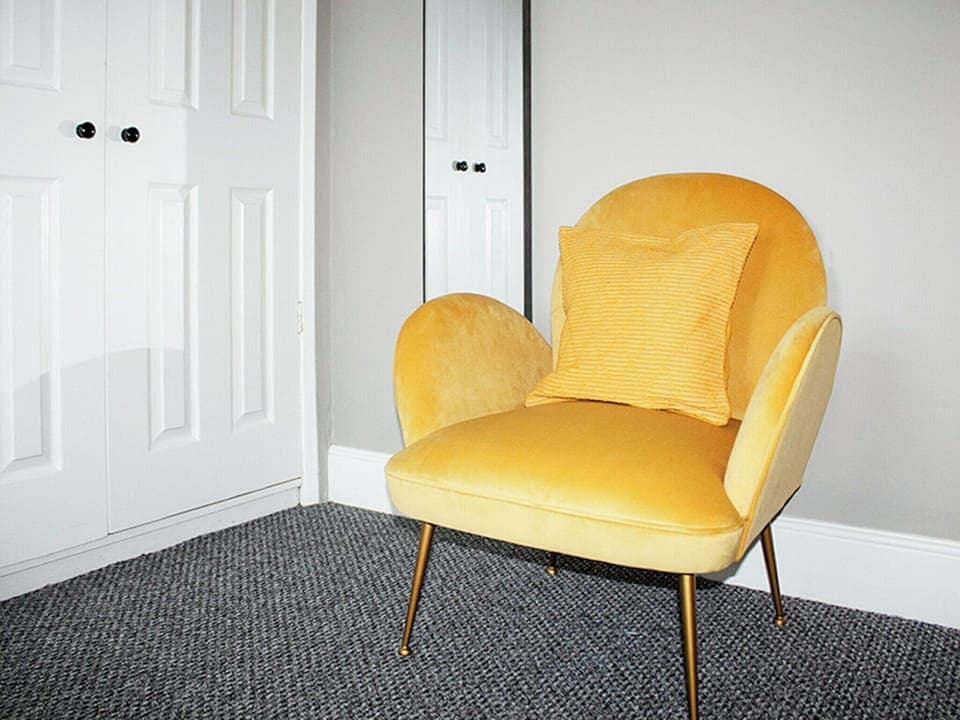 Upstairs double with comfortable armchair, perfect for relaxing with a book or your morning coffee | Captain&rsquo;s Cottage, Shanklin