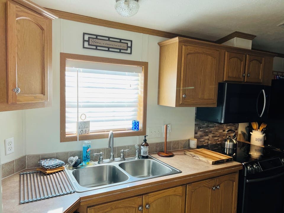 Kitchen has a garbage disposal.