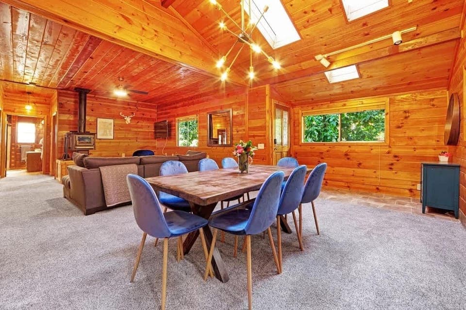 Wood-paneled walls and skylights bring warmth and natural light to this stunning open space.