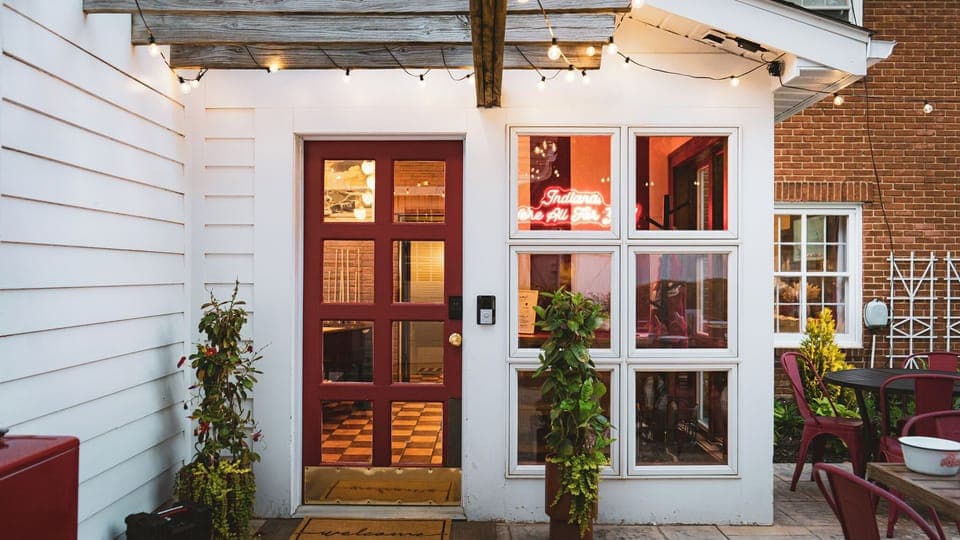 Welcome to Linden House where you are greeted with an IU tribute sign "Indiana We're All For You".  Most guests will enter through this backdoor as parking is in the alley.