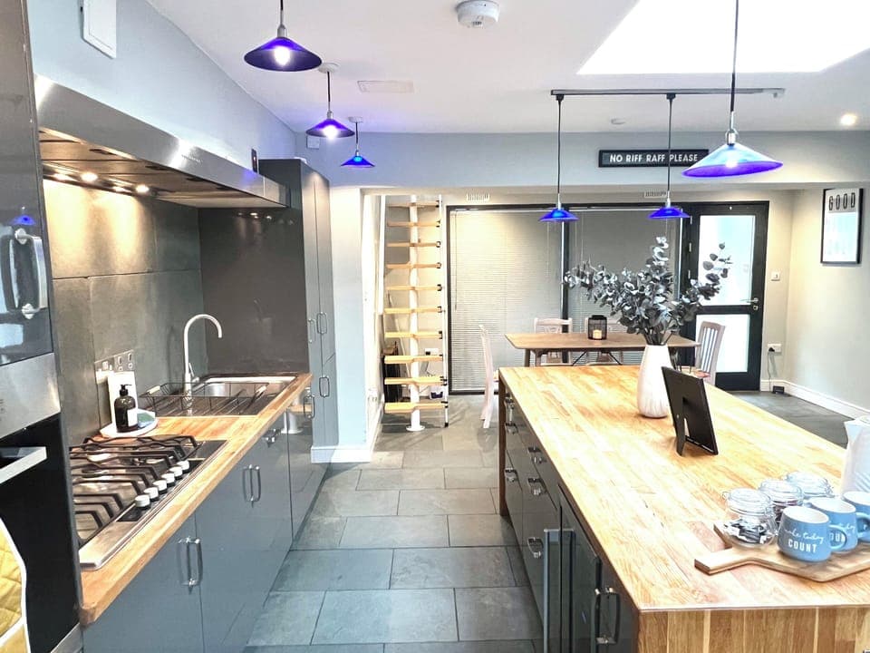 Modern Kitchen: Experience culinary adventures in this stylish space with vibrant pendant lighting!