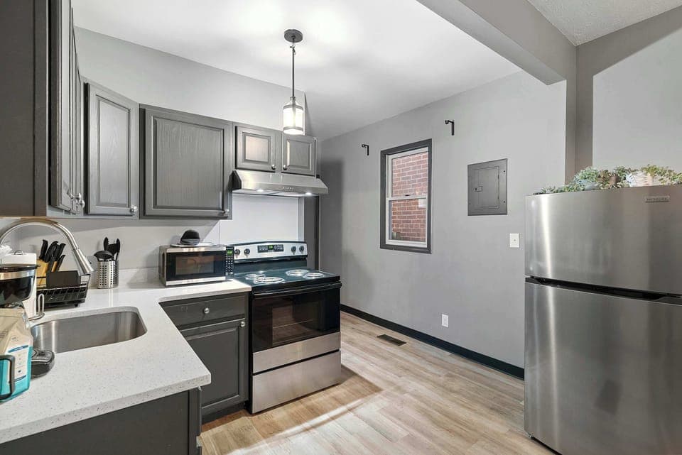 The chic, open kitchen offers ample space & every home comfort