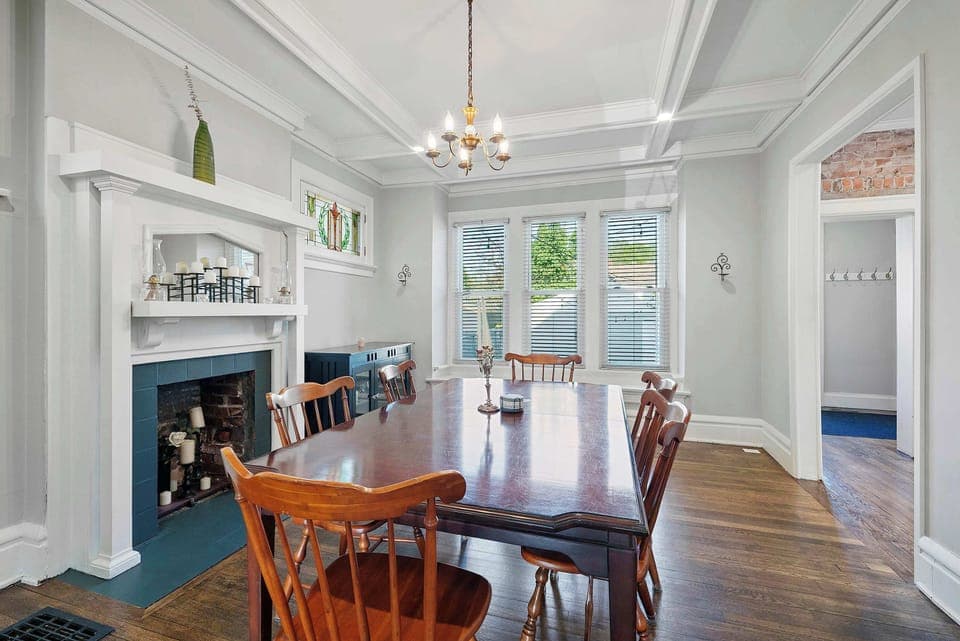 Gather for meals together in the chic dining room, offering seating for 6