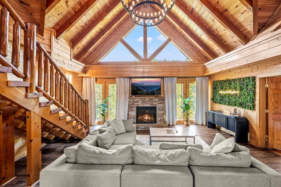 Spacious open-concept living room featuring vaulted ceilings, with Smoky views
