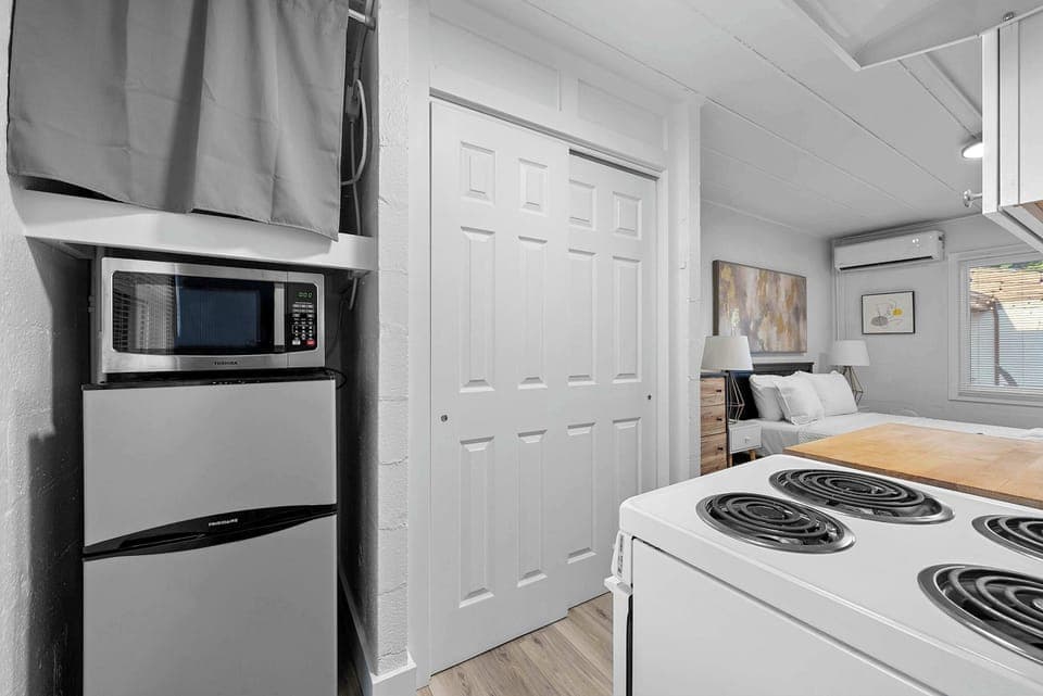The cozy kitchen offers ample storage space & every home comfort