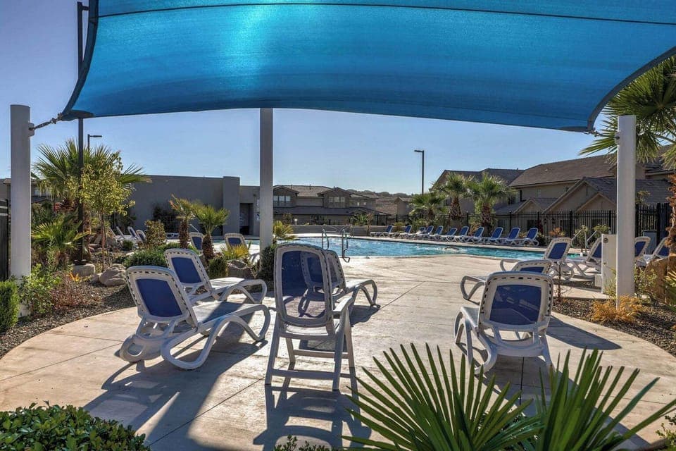 Come relax by the pool, only yards away from our front door!