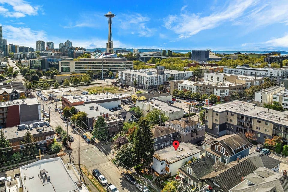 Experience Seattle from above with this stunning aerial view of the Queen Anne neighborhood, showcasing the Space Needle and urban landscape.