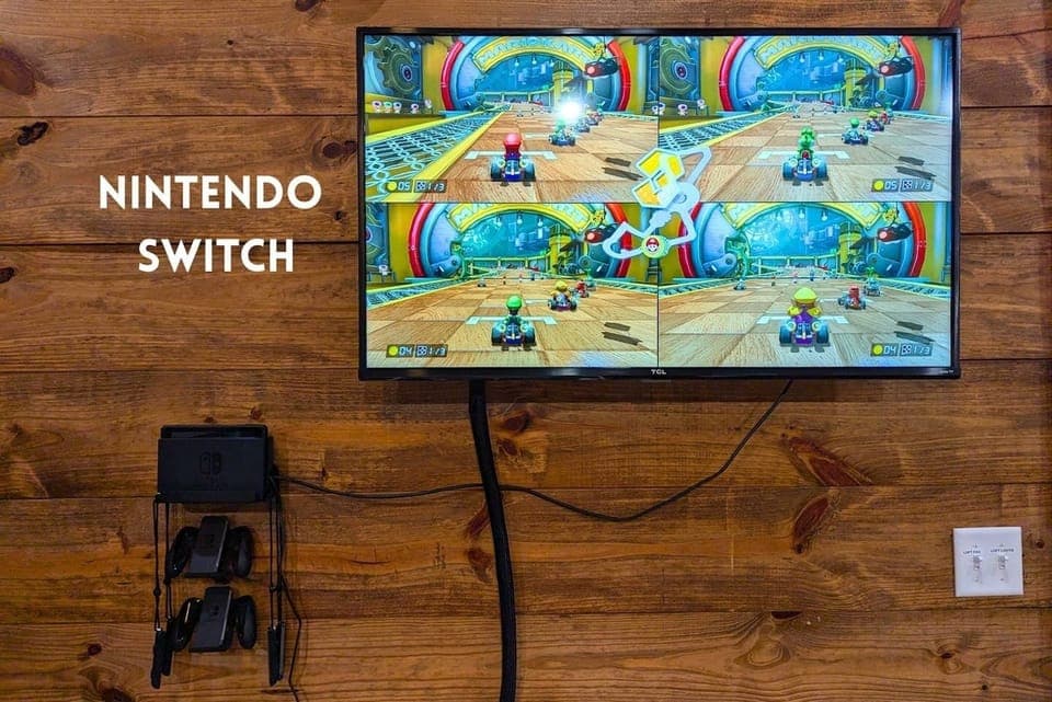 Nintendo Switch with 4 controllers and 2 games