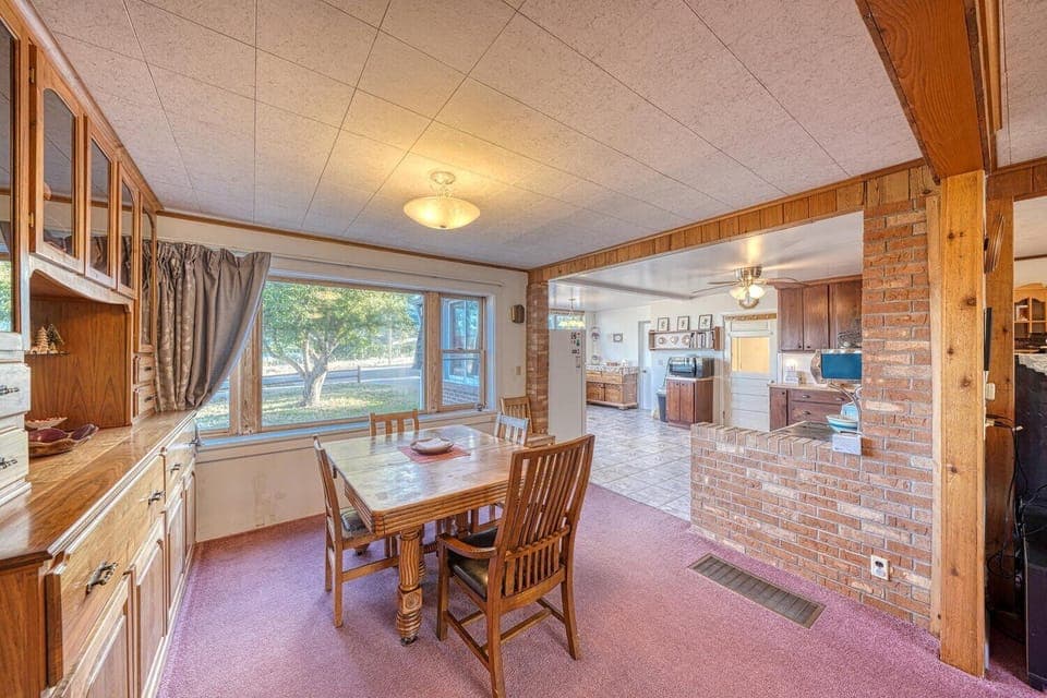 Dining table is located right off of the kitchen.