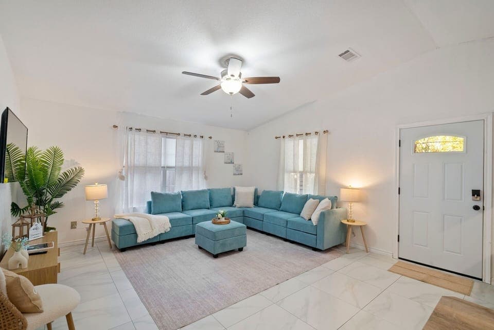 Cozy Livingroom with large sectional couch that converts into a full size bed!