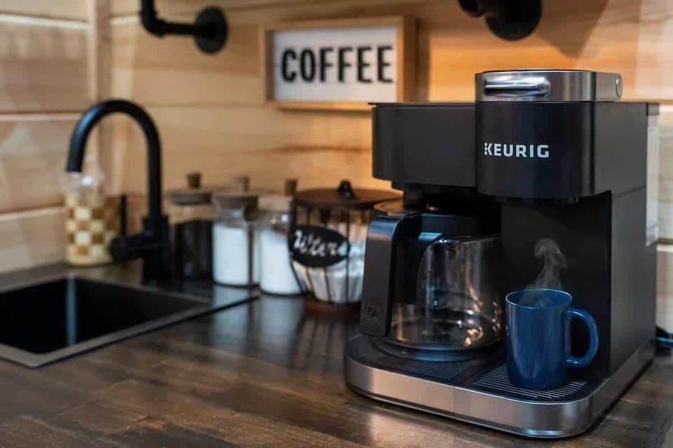 Enjoy our coffee station—grounds, pods, creamer, and sugar included.