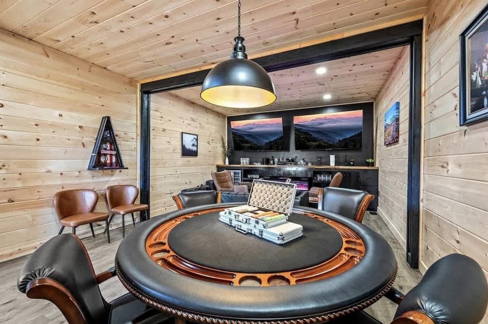 Speakeasy-style room with poker table for friendly competitions.