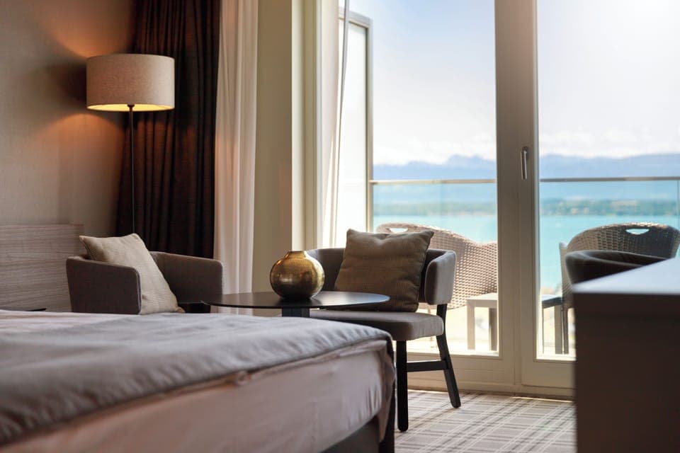 Junior Suite, Balcony, Lake View | Minibar, in-room safe, desk, blackout drapes