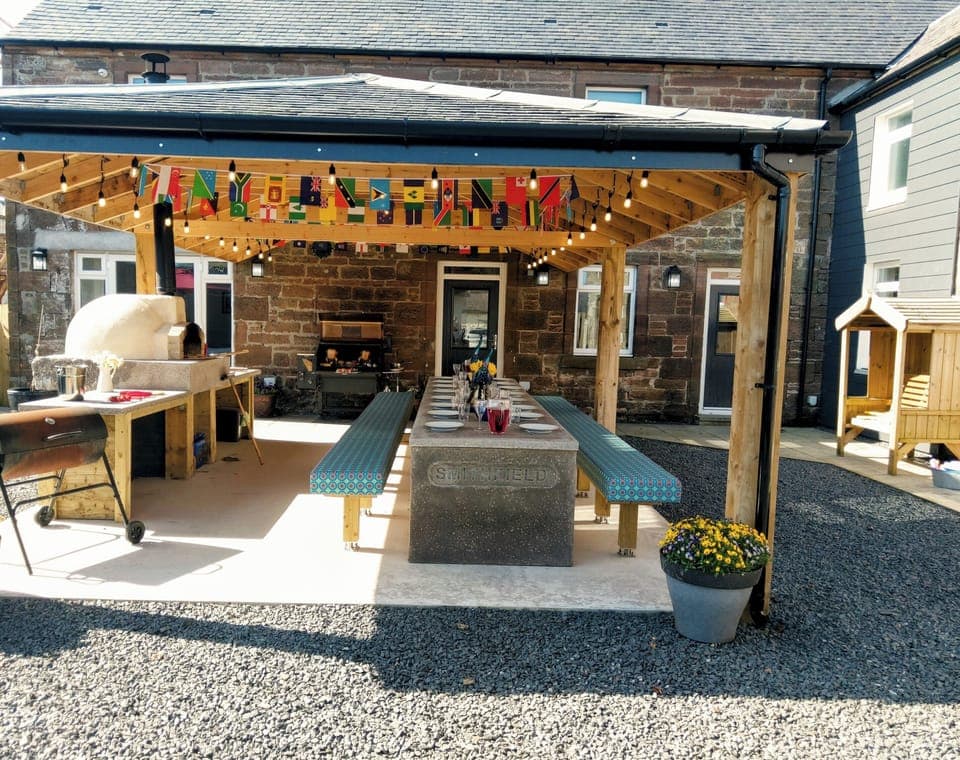 BBQ pavilion,  Wood fired pizza oven, BBQ and seating with heaters above.