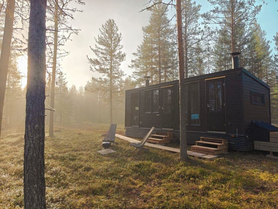 A peaceful outdoor area with forest views right beside the cabin.