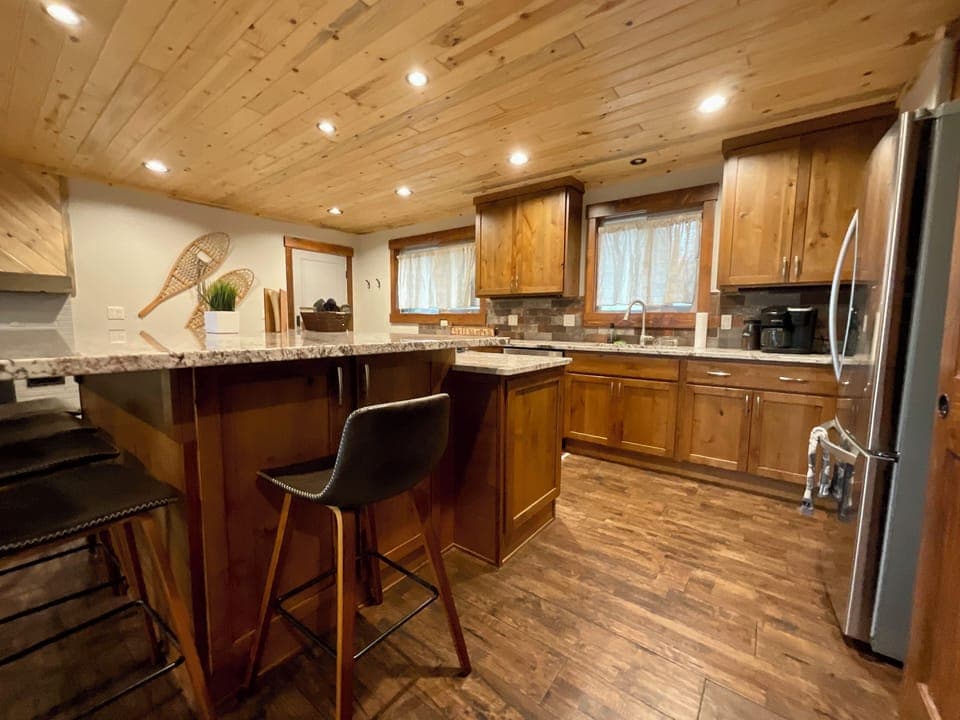Enjoy the scenery of family and friends while cooking or lounging at the bar. 