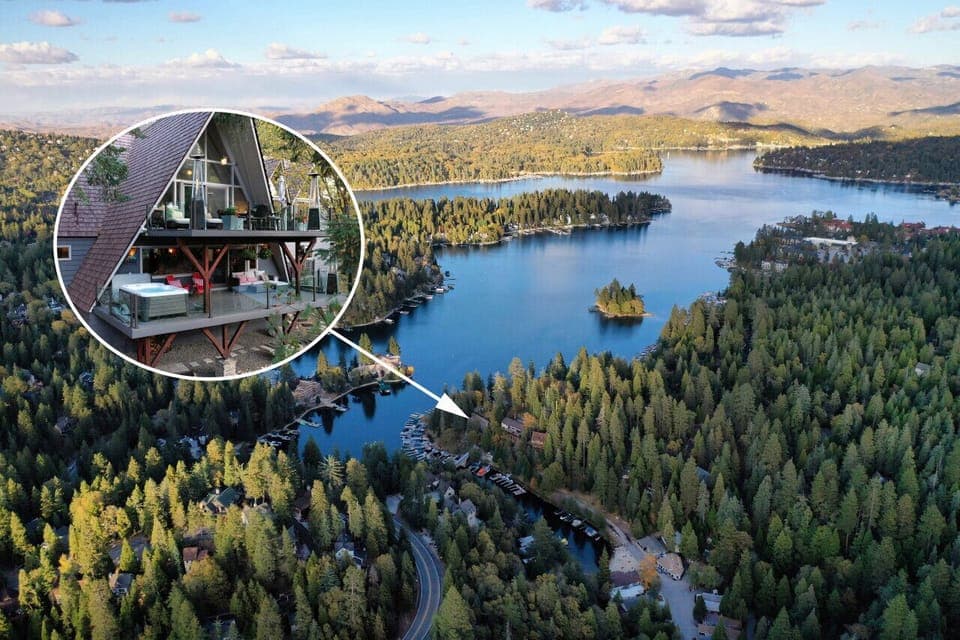 Stunning lakeside A-frame cabin with breathtaking views, nestled in a serene forest setting.