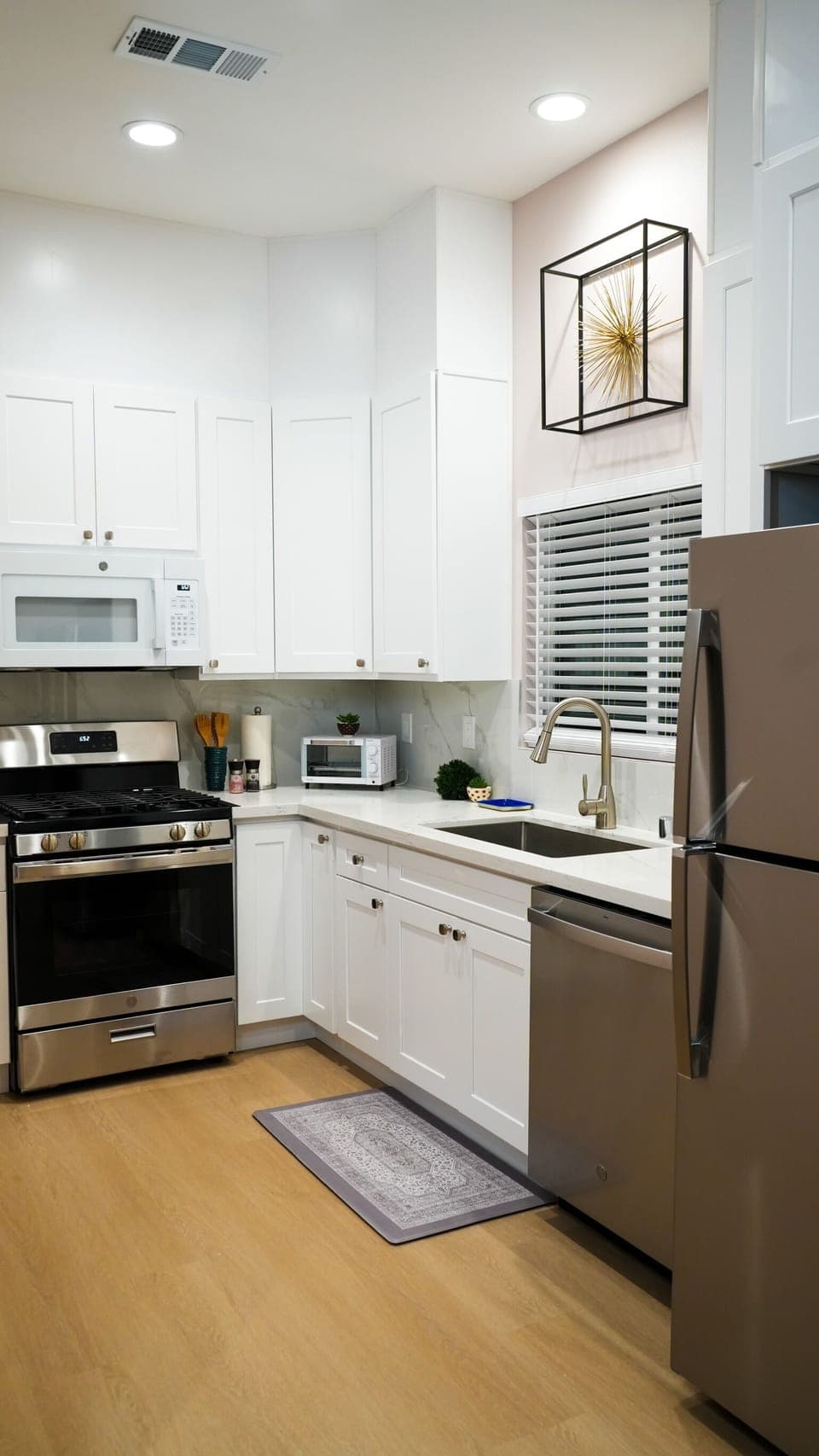 Fully loaded kitchen with oven, microwave, dishwasher, toaster and coffee pot