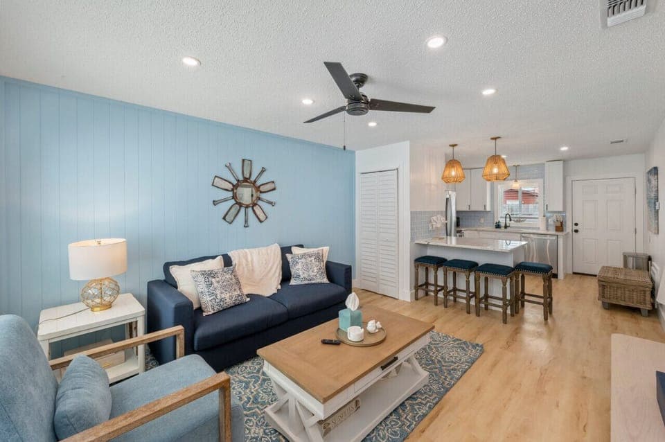 Open-concept living space with the kitchen just beside the cozy living room, creating a seamless flow for both cooking and relaxation.