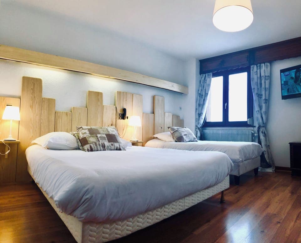 Family Triple Room | Desk, laptop workspace, blackout drapes, soundproofing