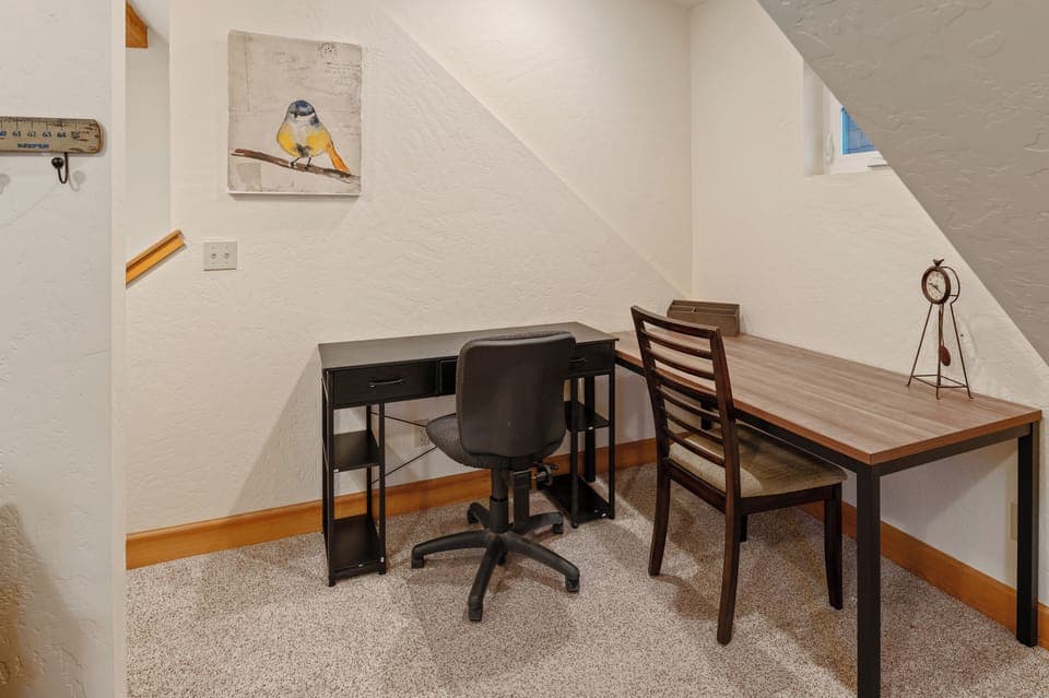 Two large desks set up for those who need to work on their vacation.