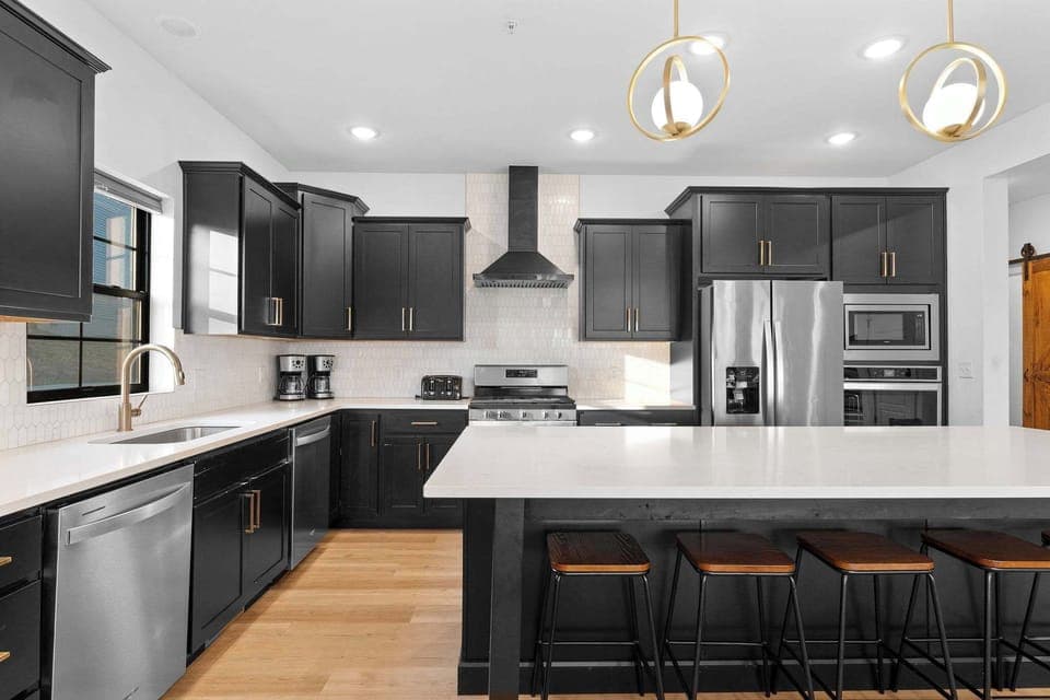 This beauty of a kitchen is fully stocked with utensils and cookware, ready for your feast!