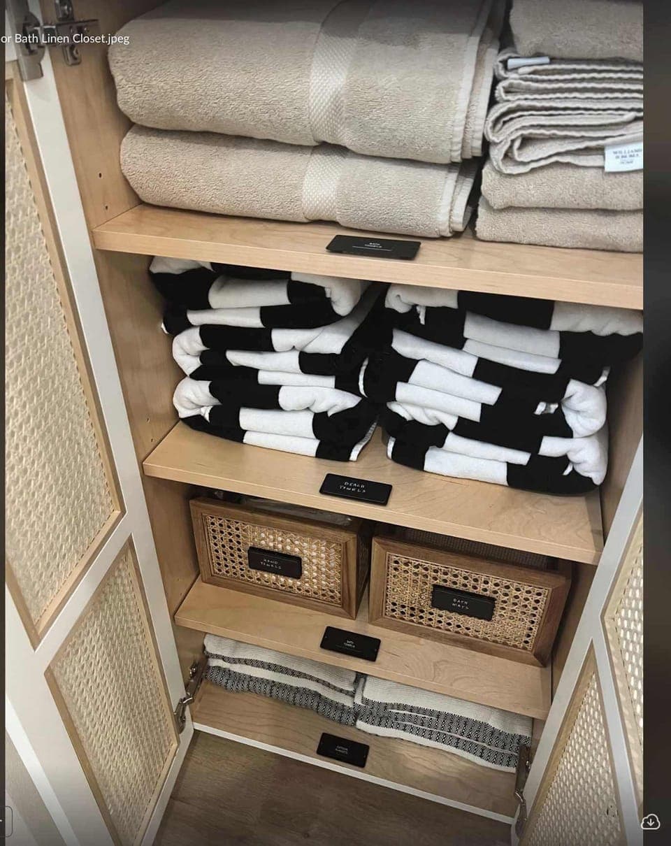 The linen closet in the downstairs bathroom is stocked with towels, beach towels, outdoor blankets and more.