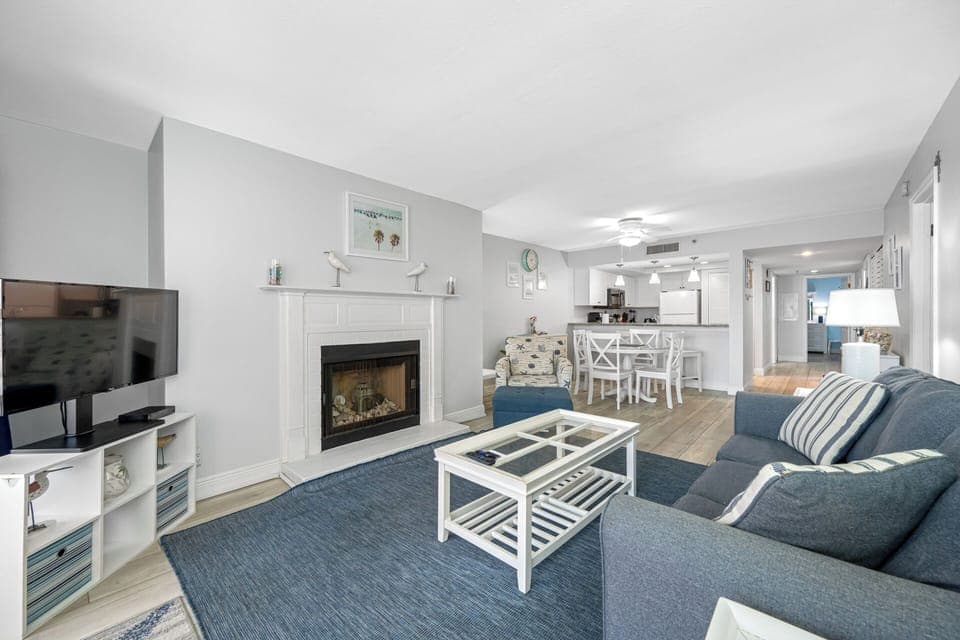 Spacious living area with ample seating and a fireplace