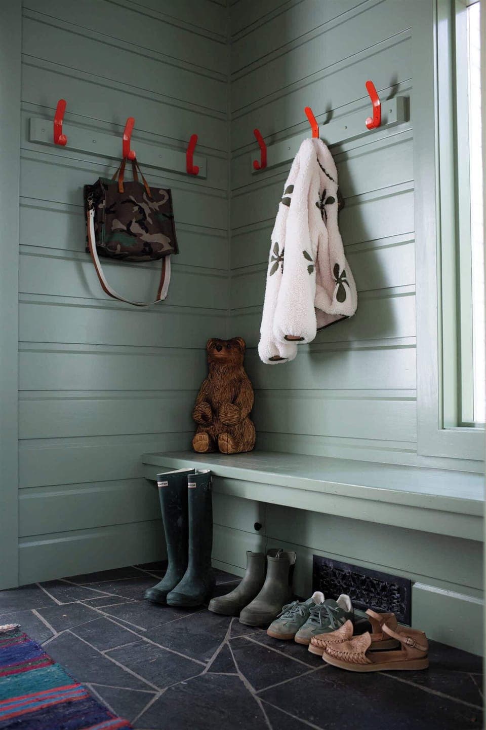 Step inside and settle in with a cozy entryway area designed for leaving shoes and essentials behind.