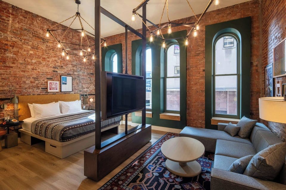 The Wanderlust | Desk, laptop workspace, blackout drapes, iron/ironing board